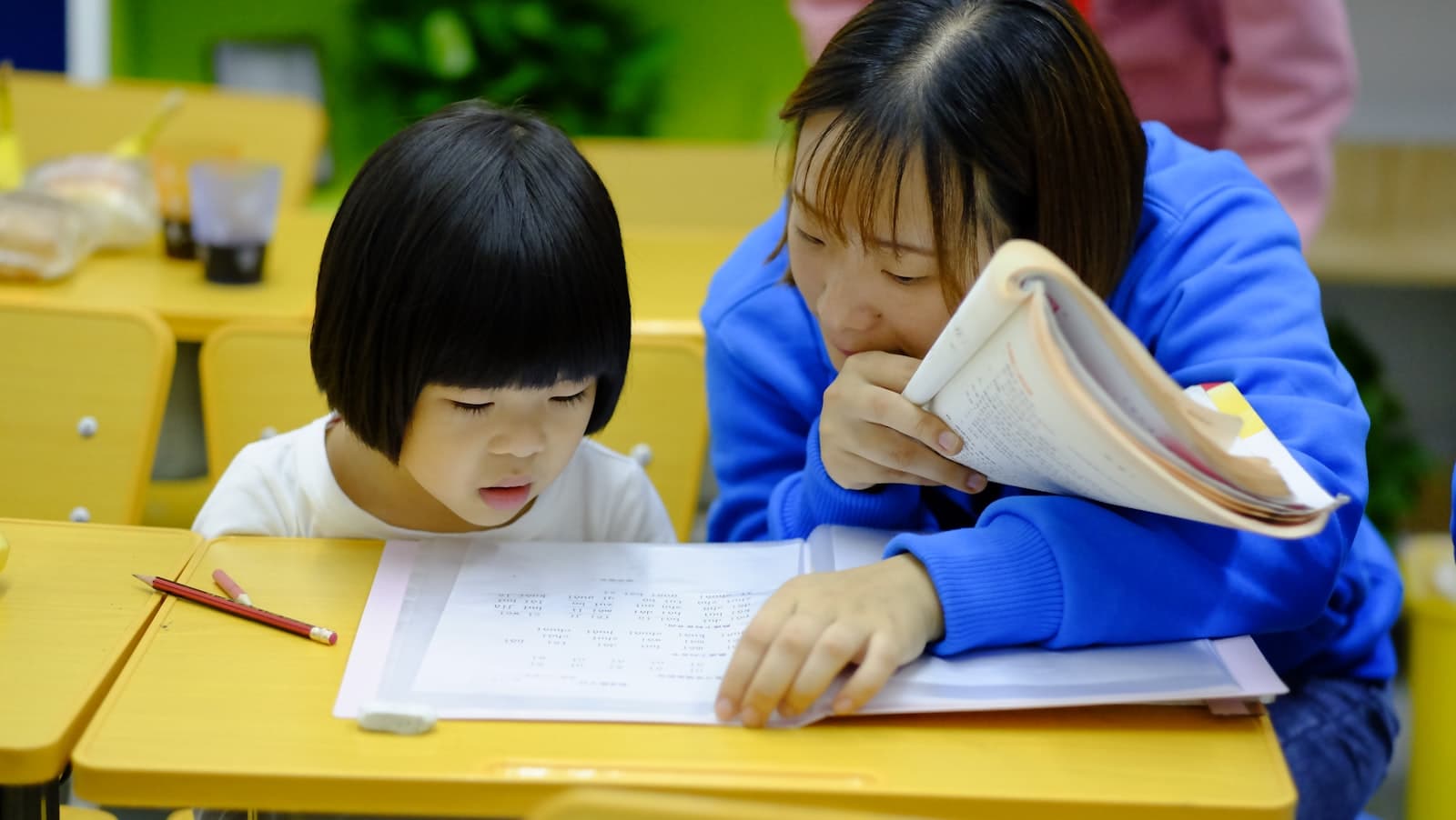 Children in a warm, sunlit preschool classroom